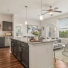 kitchen and living area with ample lighting