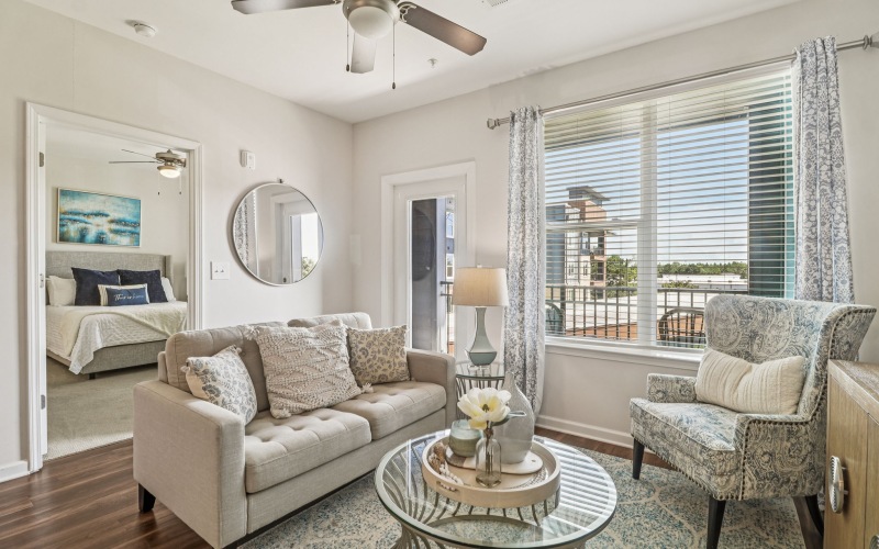 a living room with a dining table and couches