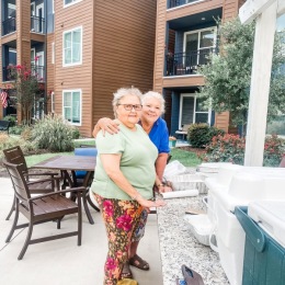 two people outside hugging