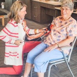 a person getting their blood pressure checked