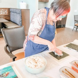 a person making sushi