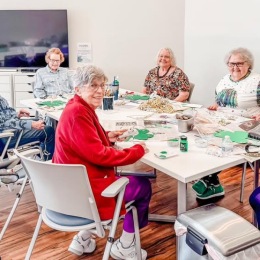 a group of people sitting at a table