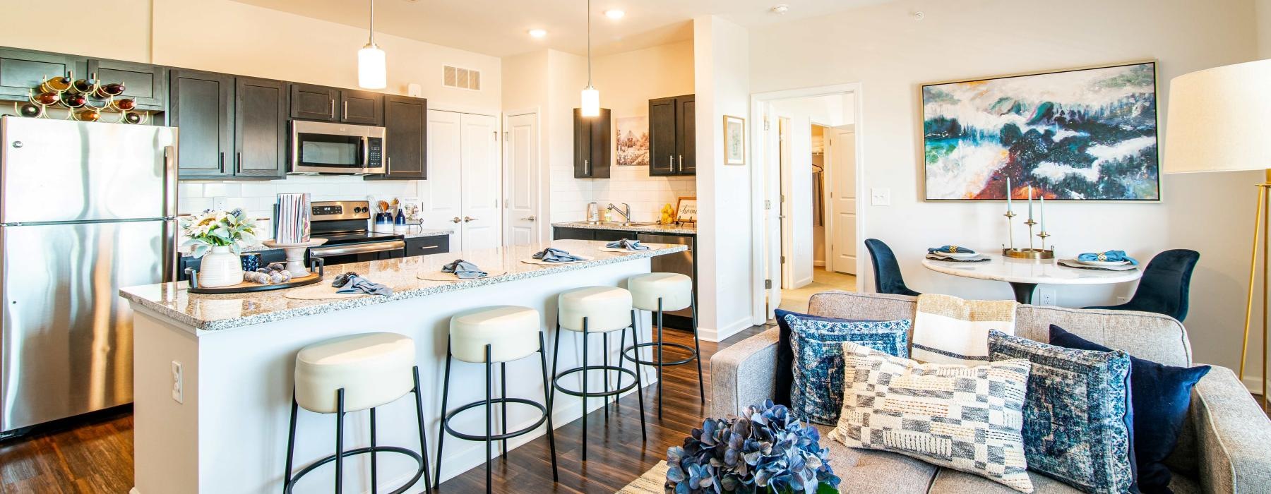 a kitchen with a dining table and couches