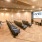a room with chairs and a screen