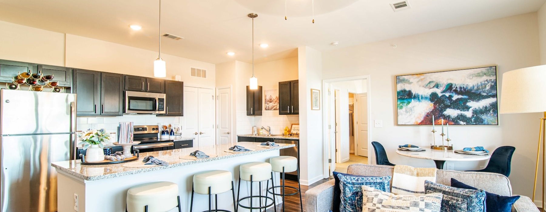kitchen and living area with ample lighting