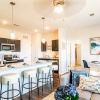 kitchen and living area with ample lighting