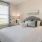 a bed with a white bed spread