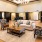 a large living room with a couch and chairs